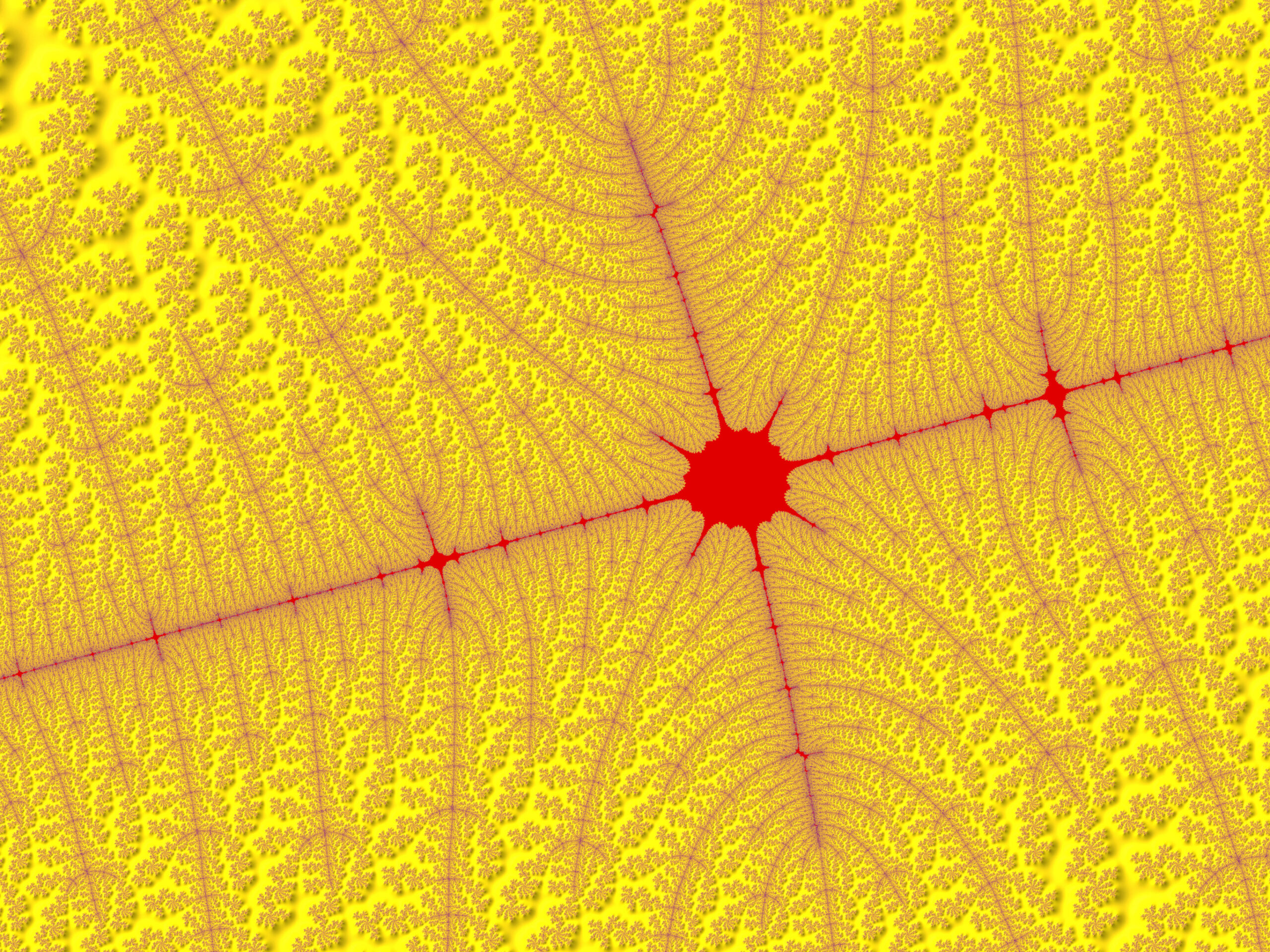 Close-up of a vivid fractal pattern: yellow field with red branching lines forming star-like centers.